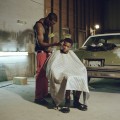 Blessing Montana is giving a haircut to his brother Satino Montana in the garage where they work. Baton Rouge, LA